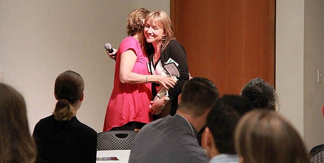 Program director Stacey York, presents Jeanne Beacham with the Excellence in Mentorship of Early Career Scientists Award.