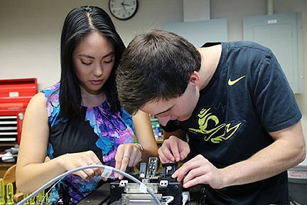 Optics students at table