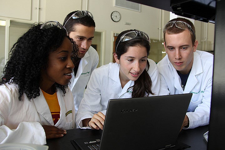 People looking at a laptop